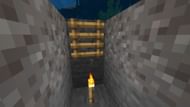 Place a ladder or a sign after mining a block to create an air pocket (Image via Sportskeeda Gaming || Mojang Studios)